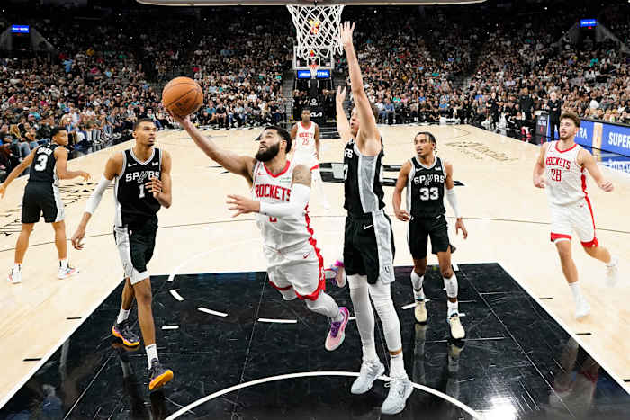 Houston Rockets guard Fred VanVleet (5) dries to the basket past San Antonio Spurs center Zach Collins (23) during the second half at Frost Bank Center.